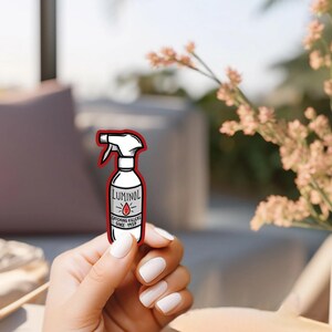 May include: A white spray bottle with a red outline and the text "Luminol Catching Killers Since 1928" on the label.