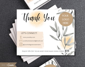 May include: White business cards with the words "Thank You" in black script. The cards feature a watercolor design with gray leaves and a peach-colored background. The cards also include the text "Let's Connect!" and social media information.