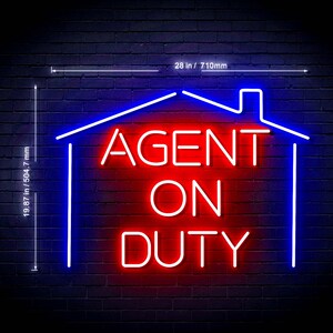 May include: A neon sign shaped like a house outline in blue with the red text AGENT ON DUTY inside. The sign measures 28 inches wide by 19.87 inches high. The bright red and blue light creates a glowing effect against the dark brick wall background.