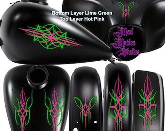 May include: Motorcycle pinstripe decals in lime green and hot pink. The decals are designed for a gas tank, fender, and fairing. The decals are made by Mad Maiden Studios.