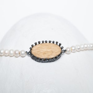 Wooden charm tied with oxidized silver on a freshwater pearl necklace, Wooden Charm, Pearl Statement Necklace. image 6