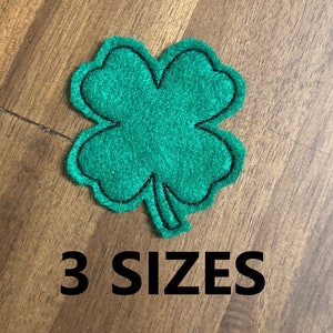 May include: Green felt four-leaf clover with black stitching. 3 SIZES.