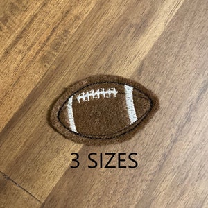 May include: Brown felt football with white stitching. 3 SIZES.