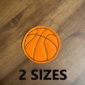 May include: Orange felt basketball applique with black stitching. 2 SIZES.