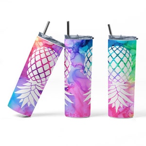 May include: Three stainless steel tumblers with a white pineapple design on a colorful watercolor background. The tumblers are all different colors, with one being pink, one being blue, and one being green.