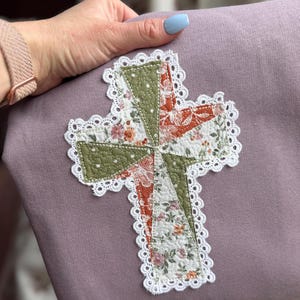 May include: A white ceramic mug with a black handle and the text "But First, Coffee" in a handwritten style. The mug is on a white surface. The mug is 4 inches tall.