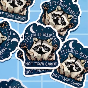 May include: A set of four stickers featuring a raccoon with the text "It's called trash can not trash cannot" on a dark blue background with white stars and a crescent moon.