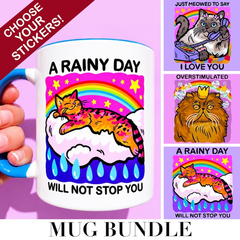 May include: A white ceramic mug with a blue handle featuring a colorful graphic of a cat resting on a cloud under a rainbow with the text A RAINY DAY WILL NOT STOP YOU. Three additional sticker designs show cats with text including I LOVE YOU.