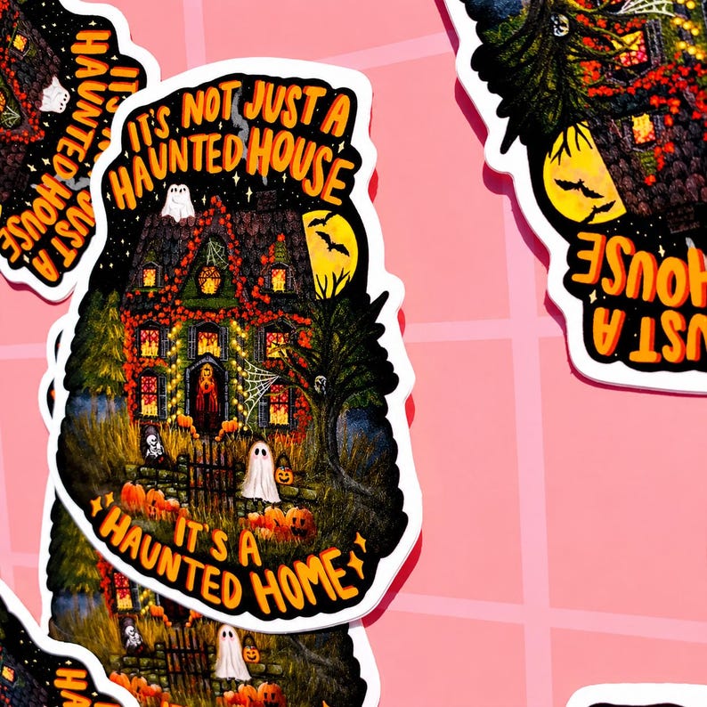 May include: A sticker with a detailed illustration of a haunted house, pumpkins, ghosts, and the text "It's Not Just A Haunted House, It's A Haunted Home." The house is lit up with orange lights, and a full moon is in the background. A spooky Halloween theme.