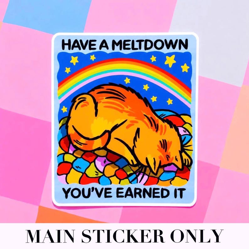 Puede incluir: Una pegatina con un gato de dibujos animados naranja, acostado sobre una cama colorida. La pegatina tiene un borde azul y presenta un arco&iacute;ris, estrellas y el texto "HAVE A MELTDOWN YOU'VE EARNED IT".