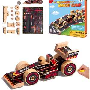 May include: A wooden race car kit with black and red decals. The car is labeled "LJ Racing Jupiter". The kit includes a screwdriver and all the pieces needed to assemble the car.
