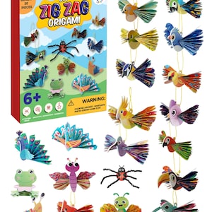 May include: A DIY Zig Zag Origami kit with 20 pieces, featuring colorful paper bird and insect models. The box includes the text "6+" and a warning about small parts. The finished models are suspended by gold strings.