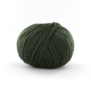 May include: A ball of dark green yarn.