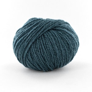 May include: A ball of teal blue yarn.