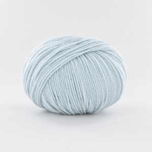 May include: A ball of light blue yarn.
