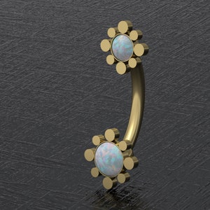 May include: Gold body jewelry with a curved barbell and two opal flower-shaped ends. Each flower has a center opal surrounded by a circle of smaller gold beads.