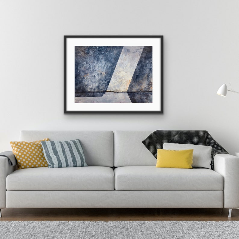 Original abstract oil painting in blue and grey by RL Fitzpatrick is displayed in a living room setting.