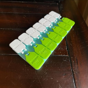 Weekly Pill Organizer – 7 Day Travel Pill Case, Color-Coded Snap-Lid Pill Box, Daily Vitamin Holder for Medication & Supplements