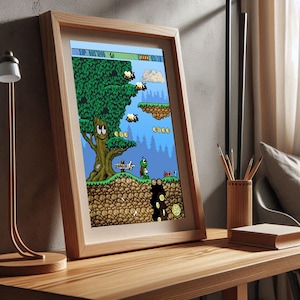 Könnte beinhalten: Ein gerahmter Digitaldruck, der eine 2D-Side-Scroller-Videospielszene zeigt. Das Kunstwerk zeigt eine grüne Figur, einen lächelnden Baum, fliegende Bienen, schwebende Plattformen und Goldmünzen vor einem blauen Himmel. Ein Schild mit DANGER ist zu sehen.