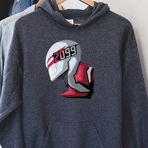 May include: Dark gray hoodie with a graphic of a futuristic helmet design. The helmet is white, gray, and red, with the number "2099" printed on the front. The hoodie has a drawstring hood and a front pocket.