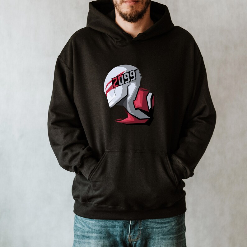 May include: Black hooded sweatshirt featuring a graphic of a futuristic helmet design with the number "2099" in white. The helmet has white, red, and gray accents. The sweatshirt has a front pocket and a drawstring hood.