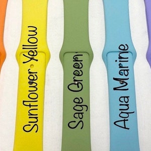 May include: Eight different colored silicone watch bands. The bands are labeled with the following colors: Rose Red, Pumpkin Orange, Sunflower Yellow, Sage Green, Aqua Marine, Lavender, Peachy Pink.