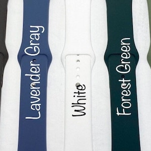 May include: Eight different colored Apple Watch bands, including black, coffee, lavender gray, white, forest green, moss green, and cement.