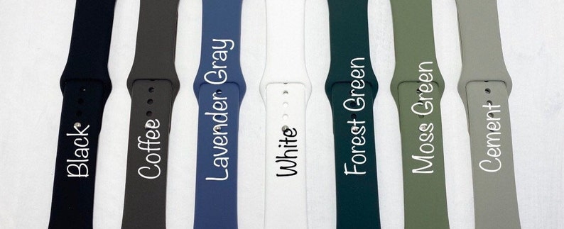 May include: Eight different colored Apple Watch bands, including black, coffee, lavender gray, white, forest green, moss green, and cement.