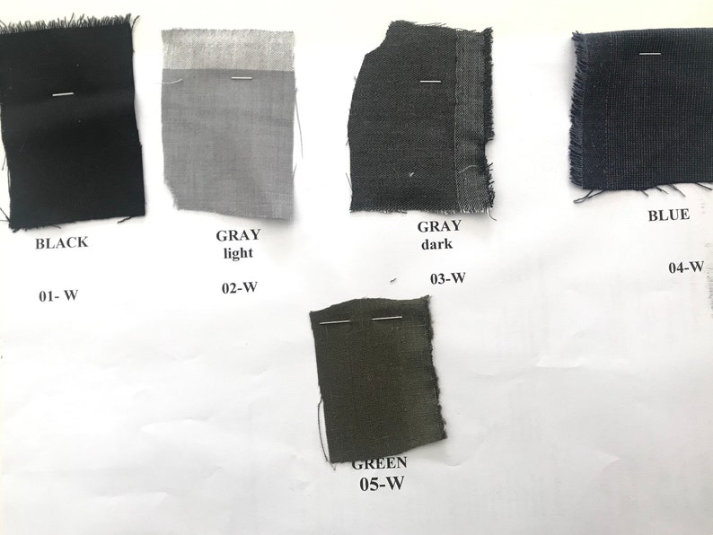 May include: Fabric swatches in black, light gray, dark gray, blue, and green. The swatches are labeled with the color and a number.