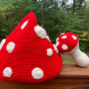 crocheted mushroom hat and mushroom plush