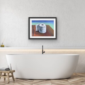 May include: A framed painting of a white toilet paper roll on a wooden surface. The background is a blue and green gradient.