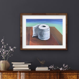May include: A painting of a roll of toilet paper on a wooden table. The toilet paper is white and has a blue and green background.