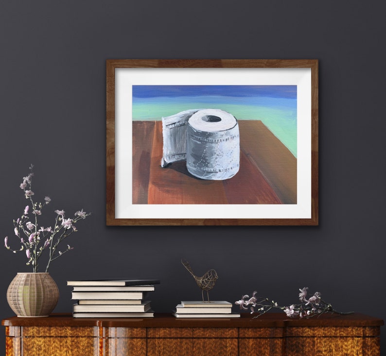 May include: A painting of a roll of toilet paper on a wooden table. The toilet paper is white and has a blue and green background.