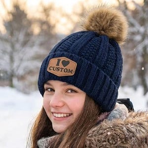 May include: A handmade wooden sign with the text "Welcome" in a playful font. The sign features a distressed white background and a dark brown frame, perfect for a front door or entryway.