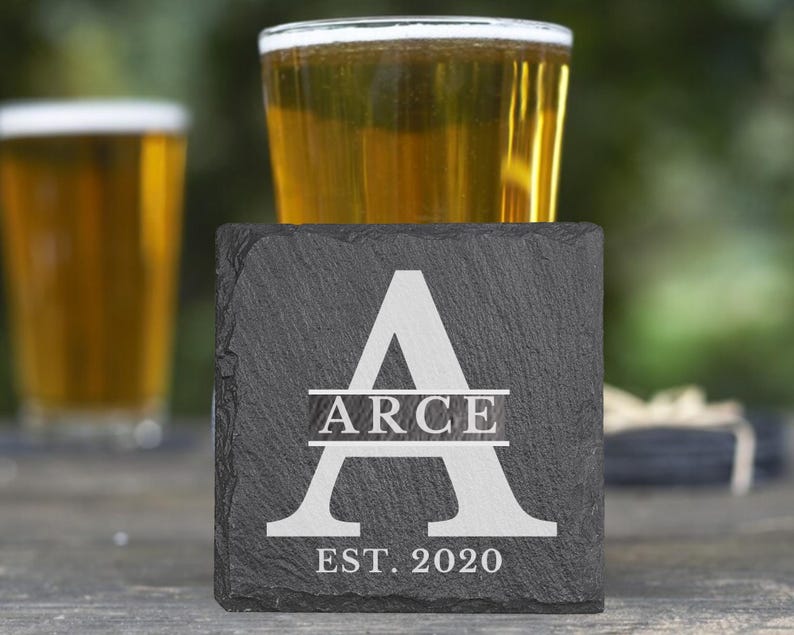 May include: Black slate coaster with a white letter A and the text "ARCE EST. 2020".