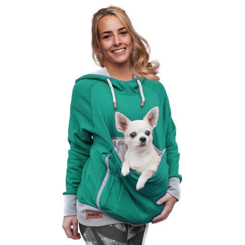 May include: A teal green hoodie with a large front pocket that can hold a small dog. The hoodie has a drawstring hood and a gray and white striped cuff. The text "ro&de" is printed on the front of the hoodie.