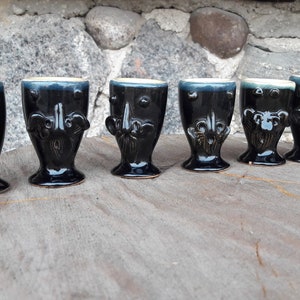 6 small vintage black glazed ceramic shot glasses set, 6 black glasses with different faces, vodka glasses set, vintage pottery glasses