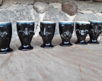 6 small vintage black glazed ceramic shot glasses set, 6 black glasses with different faces, vodka glasses set, vintage pottery glasses