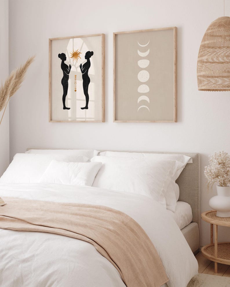 May include: Two black silhouettes of people standing facing each other with their hands raised in a prayer position. The background is a light beige with a gold sun and a window. The second image is a light beige background with a white moon phases design.