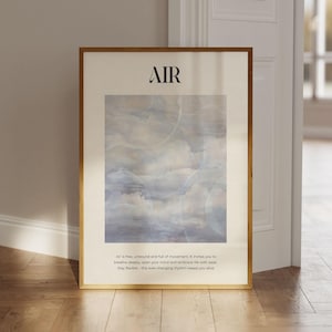 May include: A framed poster with the word "AIR" in bold black lettering at the top. The poster features a watercolour painting of a cloudy sky in shades of blue and white. The text below the painting reads: "Air is free, unbound and full of movement. It invites you to breathe deeply, open your mind and embrace life with ease. Stay flexible - this ever-changing rhythm keeps you alive."