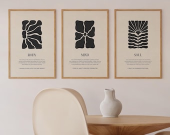 Puede incluir: Tres impresiones minimalistas en blanco y negro con diseños florales abstractos. Cada impresión tiene un título: "Cuerpo", "Mente" y "Alma". Cada título va acompañado de un breve texto que describe el concepto de cada elemento.