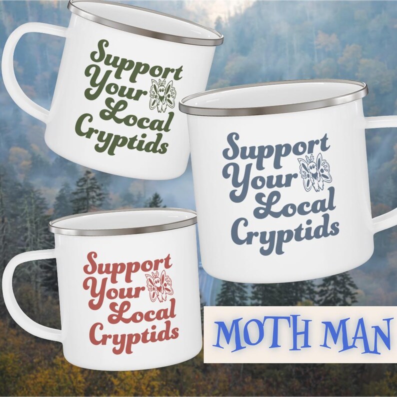May include: White enamel mugs with silver rims and handles. Each mug features the phrase "Support Your Local Cryptids" in different colors: green, blue, and red. A butterfly graphic is included. The word "MOTH MAN" is also visible.