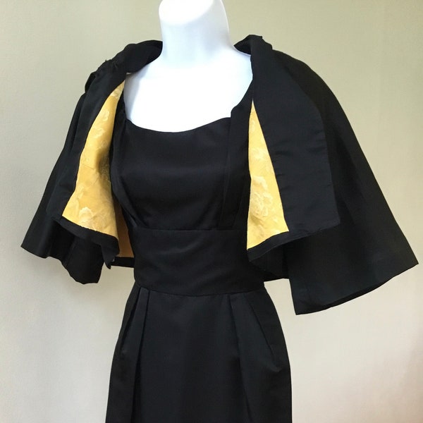 60’s black satin wiggle dress with lined short 3/4 length sleeve bolero/cape from Dorothy of Tulsa. XS/S