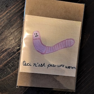 The Treachery of Images but with a worm! (art print)