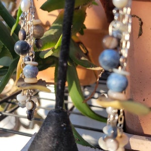 Manta ray and current (earrings)