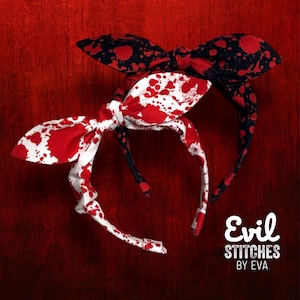 May include: Two headbands with bow details. One features a white bow with red splatter, the other a black bow with red splatter. The text "Evil Stitches by Eva" is in the lower right corner. The background is a dark red.