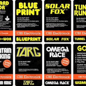 May include: A collection of eight rectangular Atari 2600 video game labels featuring black backgrounds with yellow text. Titles include Wizard of Wor, Blue Print, Solar Fox, Tunnel Runner, Mountain King, Targ, Omega Race, and Gorf, with CBS branding.