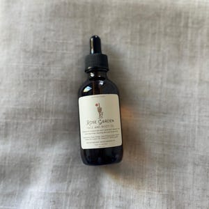 Organic Face and Body Oil, nourishing rose herbal body oil, removes makeup, cleanses skin, treats acne and dry skin, prevents wrinkles