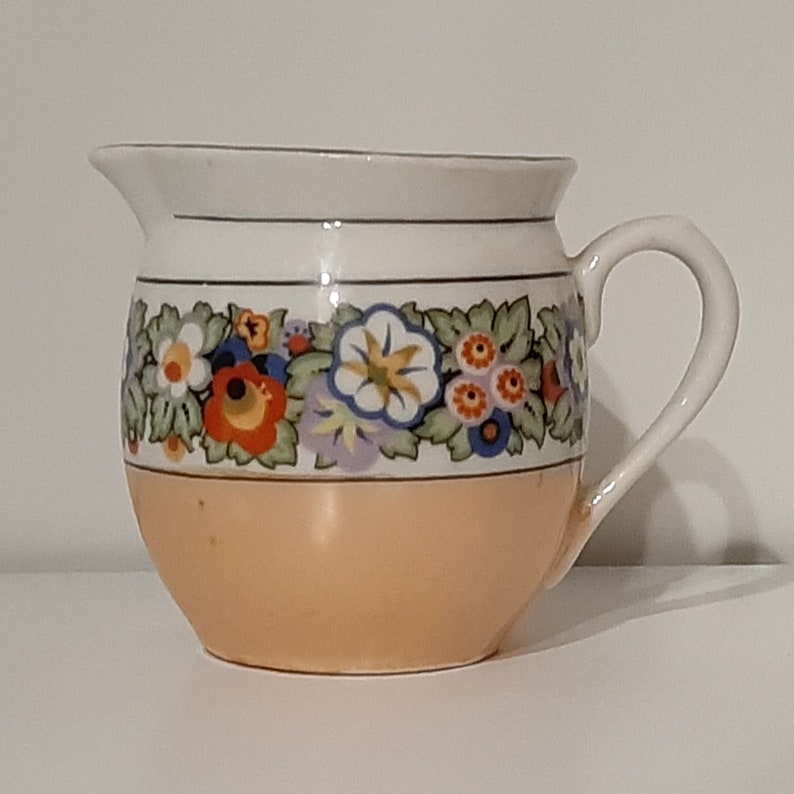 Creamer lusterware white porcelain with black & multi-color floral band/ trim, iridescent tan bottom band. Czecho-Slovakia. Vintage 1950s. image 2