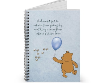 May include: A blue spiral bound notebook featuring a Winnie the Pooh illustration. The notebook includes a quote from Winnie the Pooh: "I always get to where I am going by walking away from where I have been." The illustration shows Winnie the Pooh walking with a blue balloon and bees flying around him.